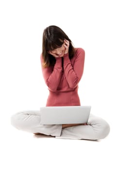 Beautiful woman with a laptop in studio with white background
