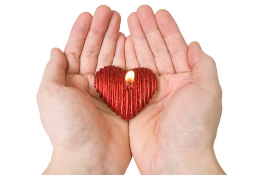 Heart-shape candle in a hands. Isolated on white background