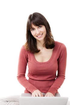 Beautiful woman with a laptop in studio with white background