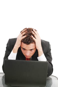 Young caucasian worried businessman with a laptop