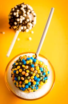 two cakepops with sprinkles
