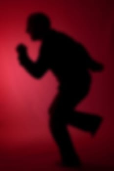 escaping as dream nightmare concept. abstract image of man in flight or motion running on the spot