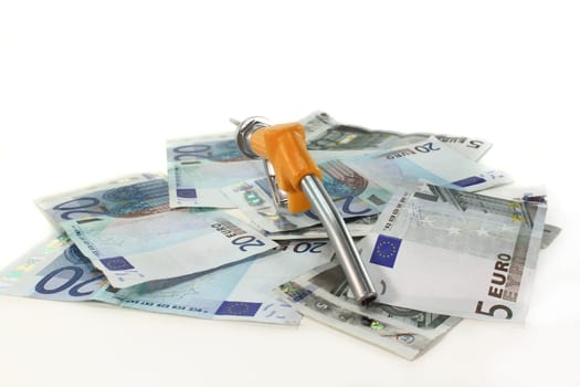 Fuel nozzle and euro bills against white background