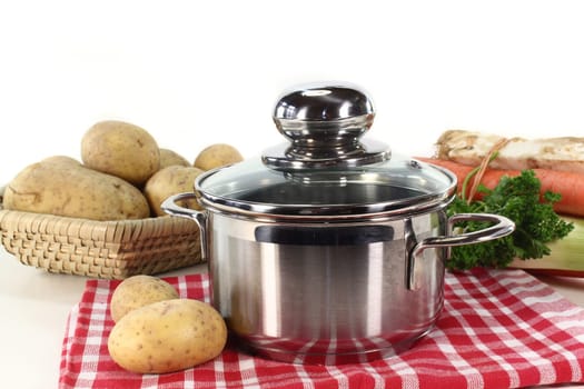 Pot and fresh ingredients for a potato soup