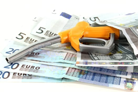 Fuel nozzle and euro bills against white background