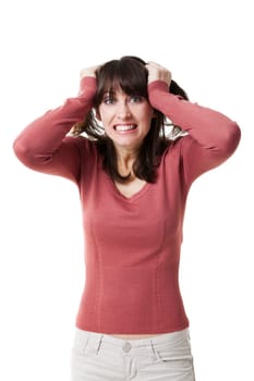 Beautiful woman pulling hair in despair. Studio shot with isolated white background.