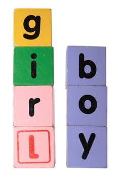 assorted childrens toy letter building blocks against a white background that spell boy girl with clipping path