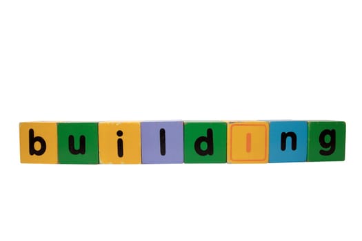 toy letters that spell building with white background with clipping path