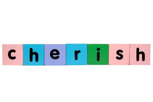 assorted childrens toy letter building blocks against a white background that spell cherish with clipping path