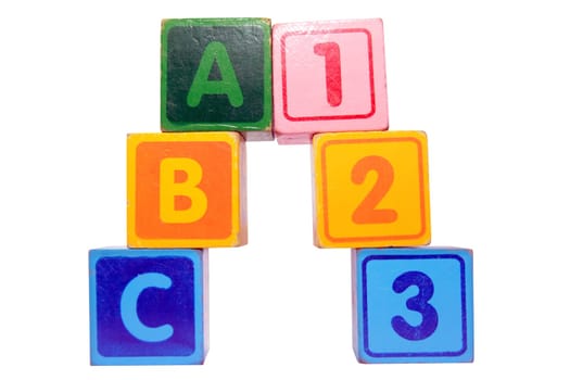 toy letter and number blocks against a white background that spell abc 123 with clipping path