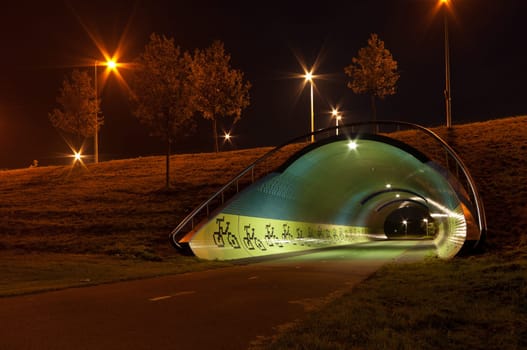 night shot of a tunnel for bicycles and pedestrians