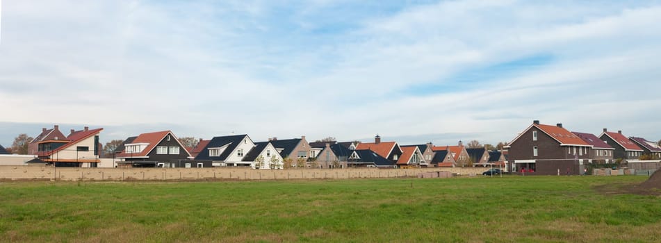 panoramic view of a residential area behind a wall