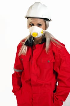 young woman builder in white helmet holding driller