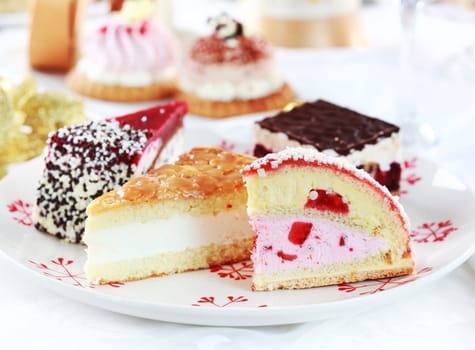 Assorted whipped cream cakes and other desserts