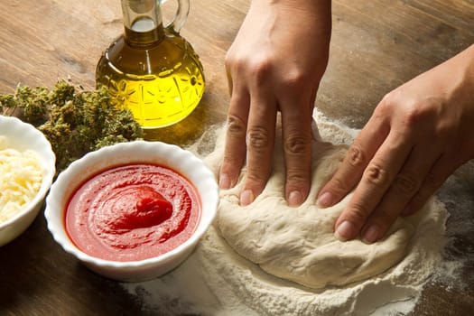 Preparing pizza dough