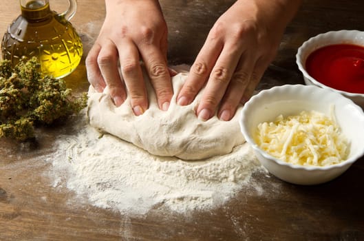 Preparing pizza dough