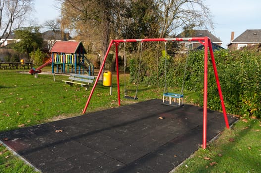 children&#039 s playground with a double red swing