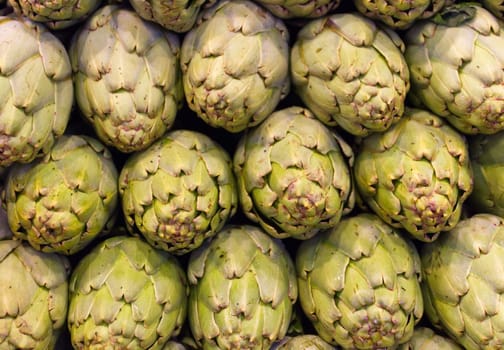 Freshly picked artichokes on display at the farmers market Boqueria, Barcelona.