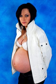 Pregnant woman on the blue mosaic background
