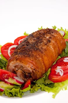 roast pork in tomatoes on the white background