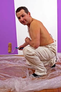 Painter painting the wall