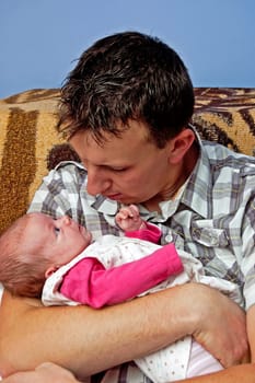 A young father of newborn daughter