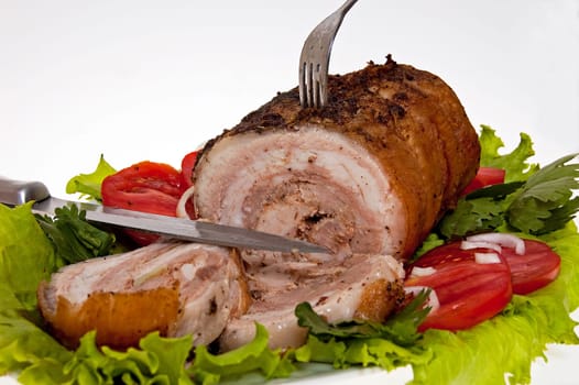 roast pork in tomatoes on the white background