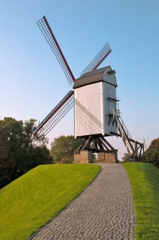Wind mill and path at afternoon  at Brugge - Belgium