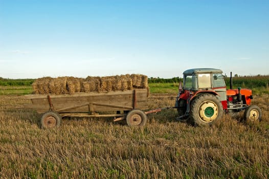 ploughing field on old tractor in southern Poland