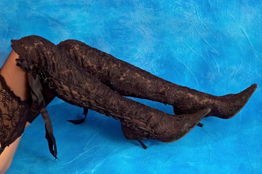 Sexy black shoes on the blue mosaic background