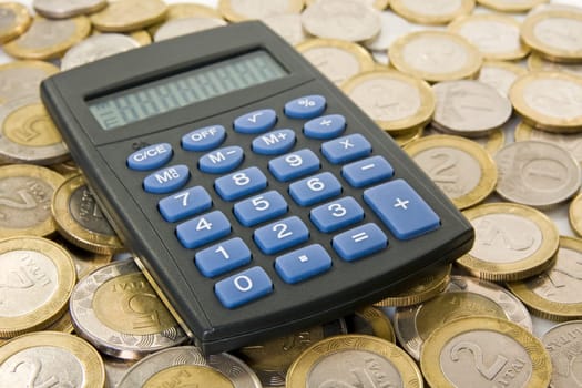 savings and economy concept. Calculator with  coins