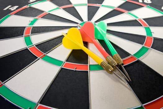 three color darts on the dart board