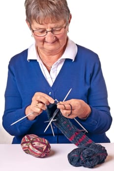 Senior woman knitting