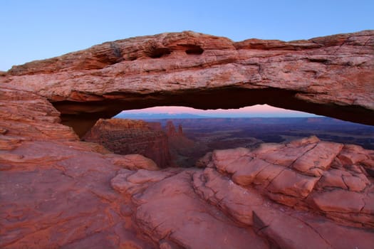 Mesa Arch of Canyonlands National Park on a calm evening.