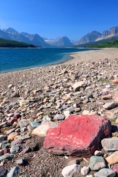 Rocky shoreline of Lake Sherburne in Glacier National Park of Montana.