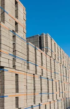 highly piled up bricks ready for transport