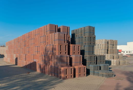 large area with piled up bricks ready for transport