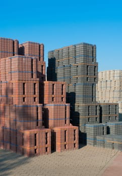 highly piled up bricks ready for transport