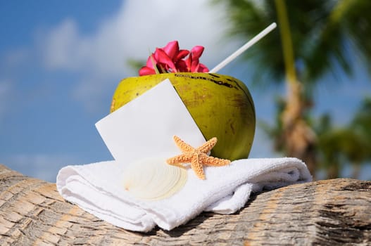 Coconut cocktail starfish tropical Caribbean beach refreshment and towel
