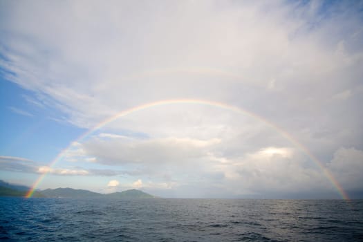 Full double rainbow over Indian Ocean in Seychelles