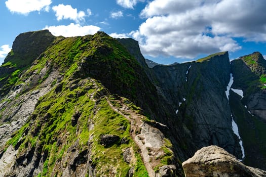 Hiking trail to top of mountain in Reine region, Lofoten islands, Norway. Beautiful Nature Norway natural landscape aerial photography