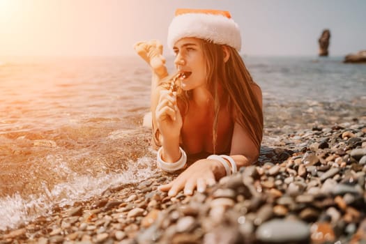 Woman travel sea. Happy tourist taking picture outdoors for memories. Woman traveler looks at the edge of the cliff on the sea bay of mountains, sharing travel adventure journey.