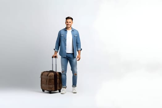young adult Caucasian male in casual clothes with suitcase on white background. Neural network generated image. Not based on any actual person or scene.
