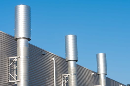 three chimneys on an industrial building