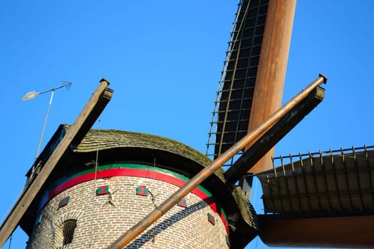 old windmill with tensioned sails