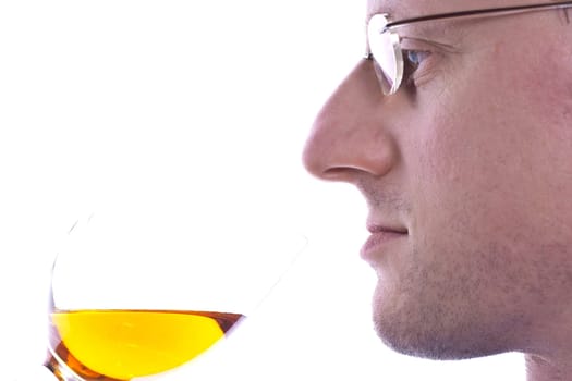 Wine connoisseur smells a white wine