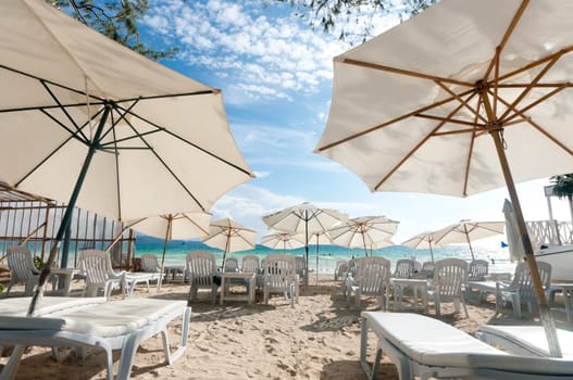white parasols on a tropical beach