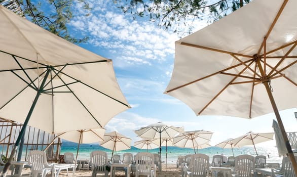 white parasols on a tropical beach