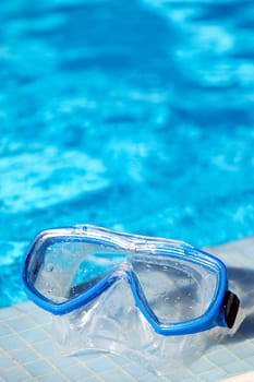 snorkel goggles and water of swimming pool