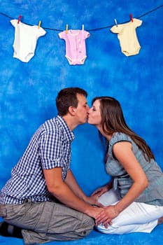 pregnant woman and her prtner greeted with yet unborn daughter